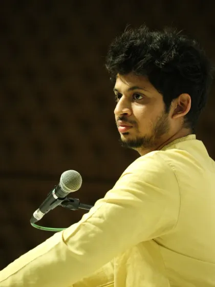 A candid shot from the Gurupurnima 2025 concert. Even in the most intense moments of a performance, there are moments of quiet introspection.