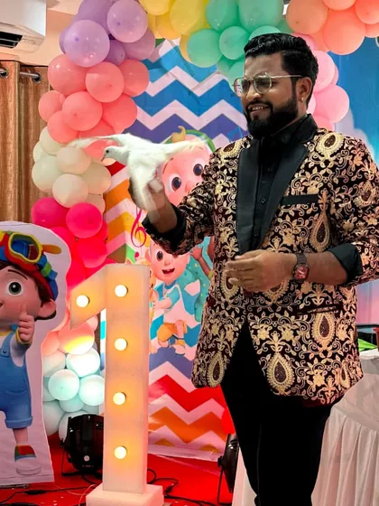 A dove rests on my hand after magically appearing during a first birthday party. Animal magic adds a gentle and wondrous touch to any family celebration.