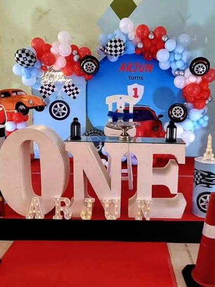 Another angle of the action-packed "Cars" birthday setup, showing the detailed character cutouts and backdrop.