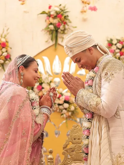 A beautiful ceremony moment. I styled the groom in an elegant ivory and gold Sulakshana Monga sherwani, which perfectly complements the bride's pink Rimple & Harpreet lehenga.