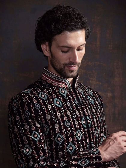 A closer look at the detailed embroidery on the patterned bandhgala. This piece is a perfect example of how I elevate classic silhouettes with unique, modern craftsmanship.