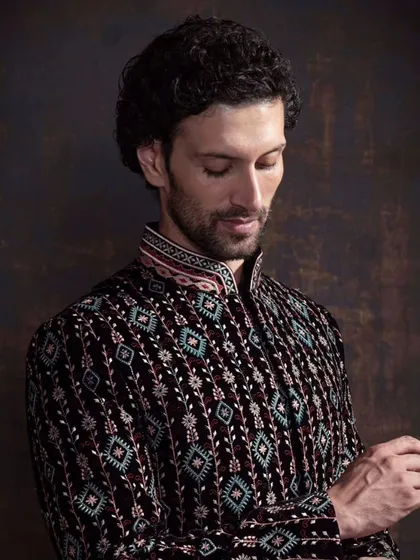 A closer look at the detailed embroidery on the patterned bandhgala. This piece is a perfect example of how I elevate classic silhouettes with unique, modern craftsmanship.