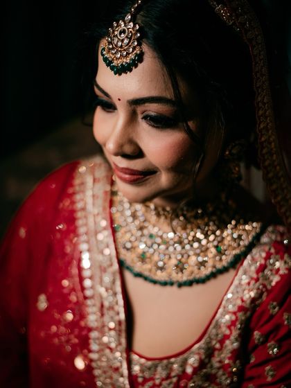 A soft, beautiful close-up of the bride, her gentle smile and sparkling jewelry captured in stunning detail.