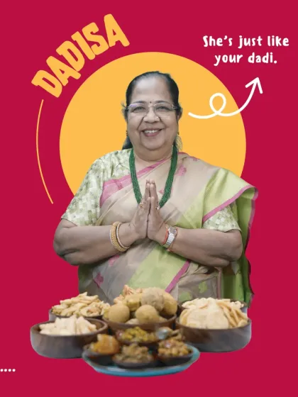 Meet Dadisaa, the heart and soul of our kitchen. She is just like your own dadi, pouring her love and years of experience into every recipe. In front of her is a spread of her signature creations, from crispy mathri to wholesome laddoos, all waiting to bring a taste of home to you.