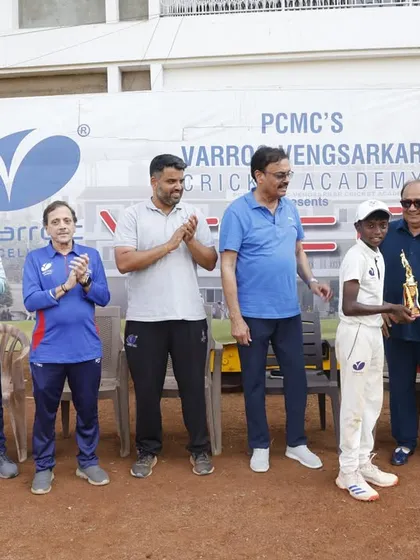 A player receiving an individual prize for his performance in the tournament.
