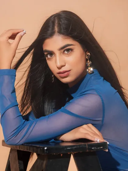 A beautiful close-up. The soft, neutral makeup allows her natural features to shine, and the simple hairstyle keeps the look modern and chic.