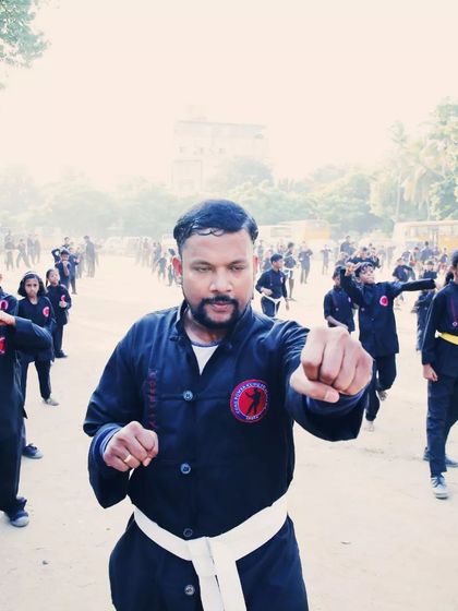 A close-up of an instructor leading the class with a powerful punch. Leading by example is a core part of our teaching philosophy.