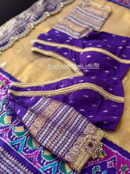 A purple blouse with sleeves made from a woven Patola-style fabric, showcasing how we blend different textile traditions.