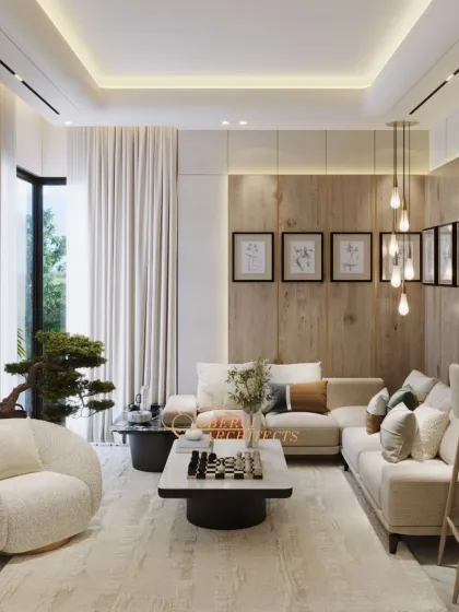 A serene living area designed with a neutral color palette and warm wood accents. The layout is open and inviting, with large windows that flood the space with natural light.
