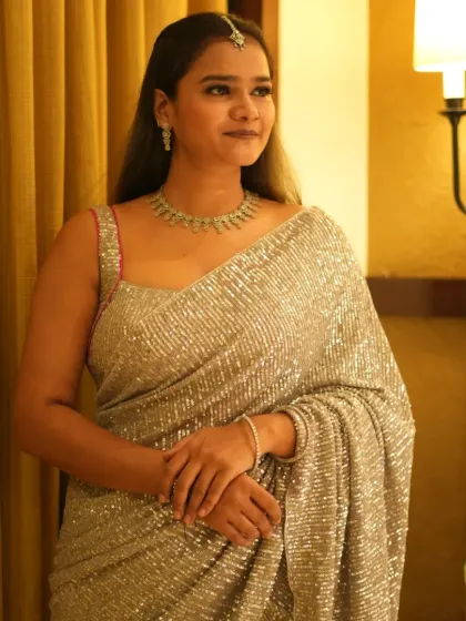 A classic, elegant pose in the silver saree. This look is timeless and perfect for high-end ethnic fashion brands.