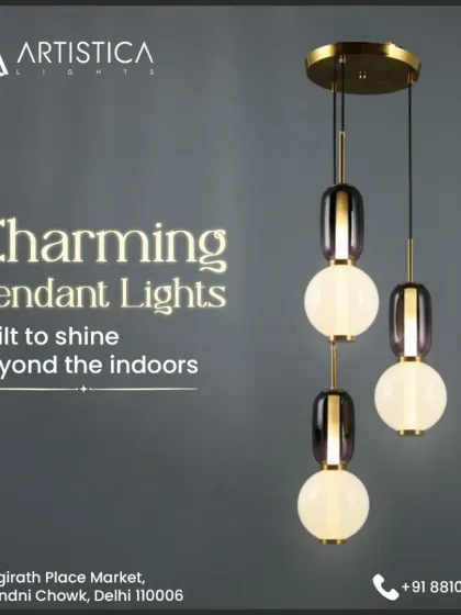 This charming cluster of pendant lights combines frosted white globes with elegant metallic accents. It's a versatile piece that works beautifully in a variety of settings, from a stylish entryway to a cozy reading corner, providing a soft and welcoming glow.