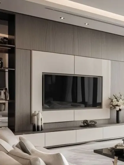 A full view of a modern entertainment wall we designed. It combines dark wood, white panels, and integrated shelving to create a functional and visually striking focal point in the living room.