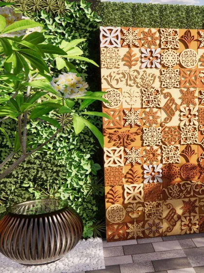An artistic and decorative wooden panel with intricate carvings is set against a living wall. This design element adds a unique, handcrafted touch to the garden, blending natural materials with detailed craftsmanship.