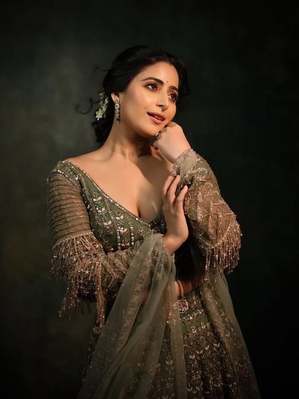 A beautiful portrait that captures the elegance and grace of the festive look. The makeup is soft and glowing.