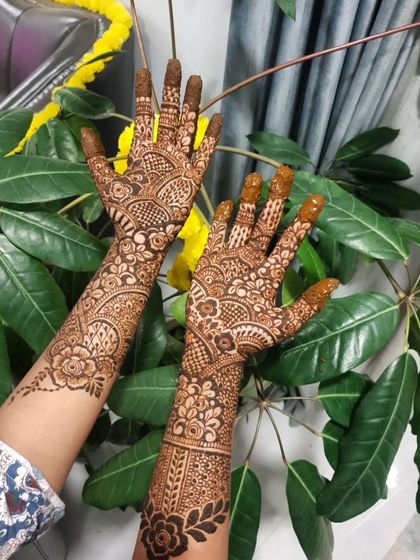 An intricate floral and geometric design, perfect for a wedding guest or bridesmaid.