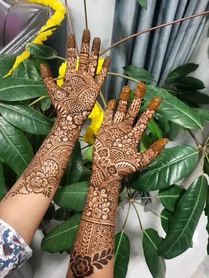 An intricate floral and geometric design, perfect for a wedding guest or bridesmaid.