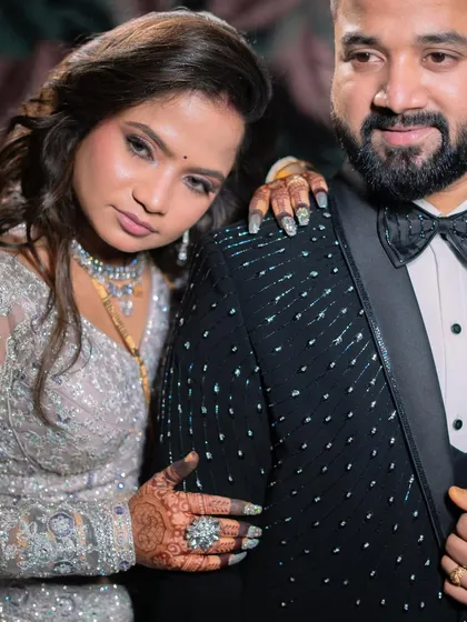 A stylish and modern reception portrait. The bride's glamorous makeup and confident pose create a powerful image.