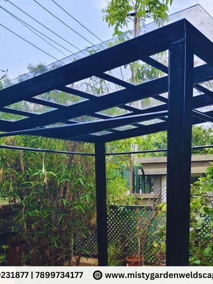 A completed 3mm compact sheet pergola in Chikkagubbi, turning a backyard into a perfect shaded retreat. The durable metal frame and high-quality compact sheet offer excellent shade and weather resistance with a clean, modern look.