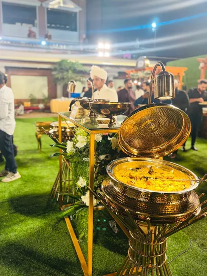 A beautiful, hammered-brass pot holding aromatic Mutton Mandi, a traditional rice and meat dish that is a centerpiece of my menu.