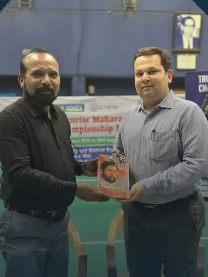 Dr. Amol Bhanushali being presented with a book as a token of appreciation. I ensure all our special guests are honored in a thoughtful and respectful manner.