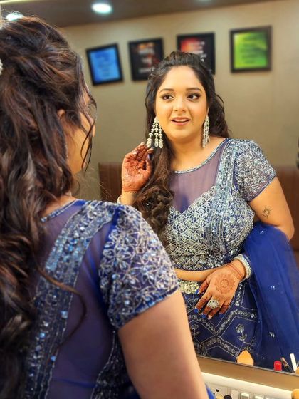 A soft dewy glam look for an engagement party. The mirror shot captures the beautiful details of her hair and makeup from all angles.