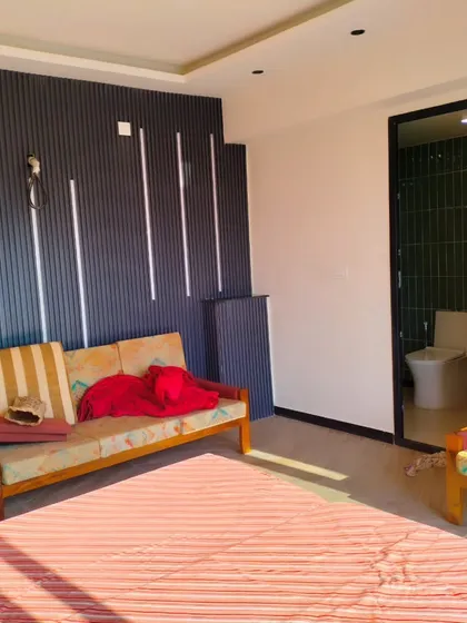 This view shows the layout of the terrace bedroom and its attached modern bathroom, demonstrating our capability to build fully functional living quarters.