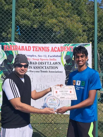 A closer look at Mukil Ramanan with his finalist trophy and certificate at the Faridabad AITA tournament.