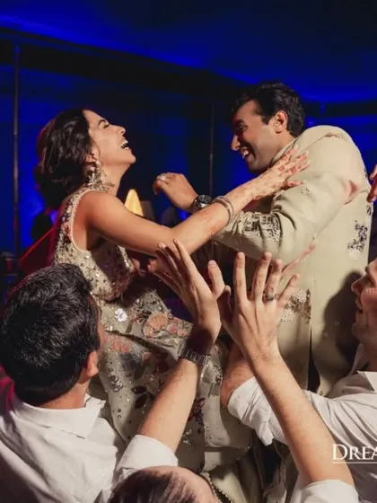 A moment of pure joy as the couple is lifted up by their friends. I strive to create an atmosphere where everyone feels comfortable celebrating with enthusiasm.