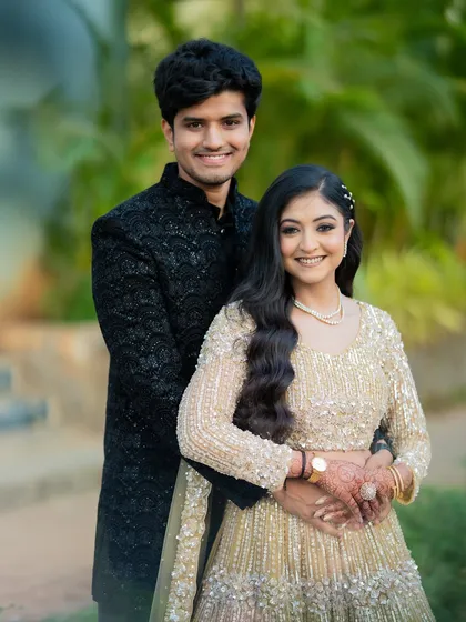 A classic portrait of Apoorv and Shikha, smiling for the camera. This type of shot is essential for any engagement album, capturing the couple looking their best.