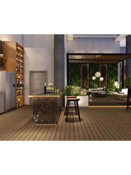 An integrated view of the outdoor kitchen and the lounge area under the pergola, demonstrating a seamless flow between cooking, dining, and relaxing.