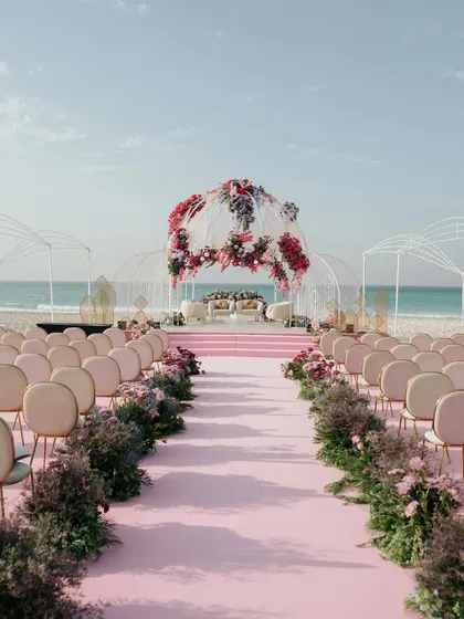 A breathtaking beachside mandap in Abu Dhabi, ready for the sacred vows. This image showcases my experience with large scale destination weddings and capturing the beauty of bespoke decor.