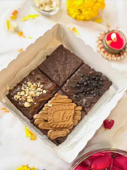 The assorted brownie box is a Diwali favorite. This box of 4 features a classic brownie, Nutella hazelnut, double chocochip, and a Lotus Biscoff brownie.