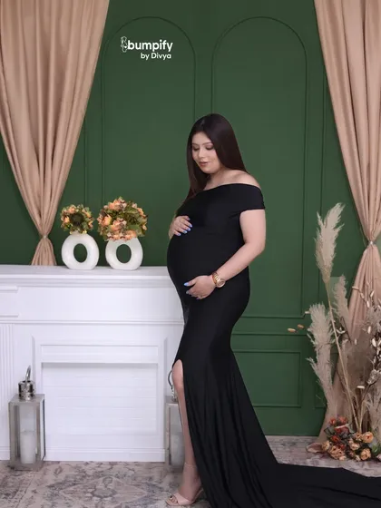 Looking down at her bump, this mom-to-be shares a quiet moment of connection with her baby. A simple, beautiful, and timeless maternity photo.