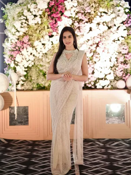 Posing against the floral backdrop for the 50th-anniversary celebration. Every detail was curated to reflect the beauty of a lifelong partnership.