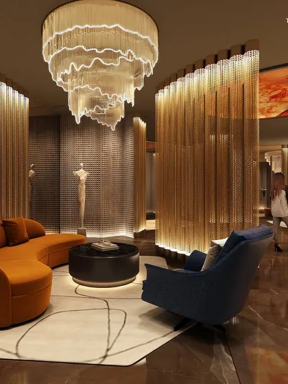 Another view of the Palais Royale lounge, showcasing the interplay of light and texture. Backlit wooden screens and a stunning chandelier create an ambiance of understated grandeur and exclusivity, perfect for intimate conversations or quiet reflection.