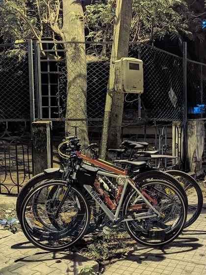 Five bikes stacked together, a symbol of our growing community. This was from our third community ride, where we welcomed our first women attendees.