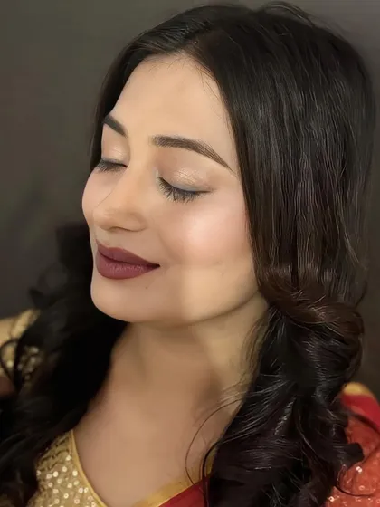 A moment of quiet confidence. This image showcases the smooth, airbrushed-like finish of the skin and the soft, shimmery eyeshadow.