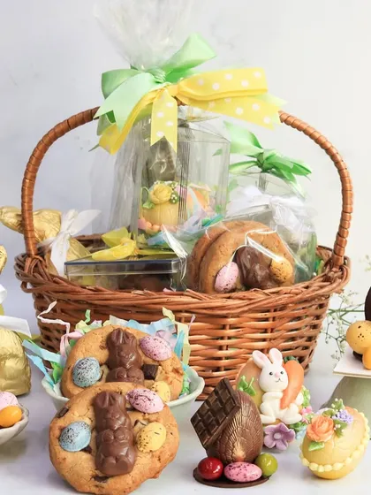 My classic Easter Basket, a wicker basket brimming with treats like a chocolate bunny, marzipan eggs, decorated cookies, and more. It's everything you need for the perfect Easter morning.
