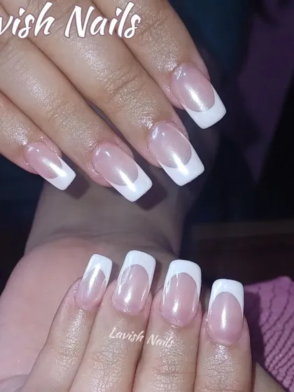 A classic French manicure with a deep smile line on medium-length square nails.