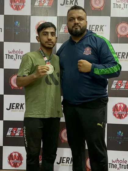 Me with one of our fighters after a hard-fought battle. Wins and losses are part of the game, but the team spirit and effort are always remarkable.