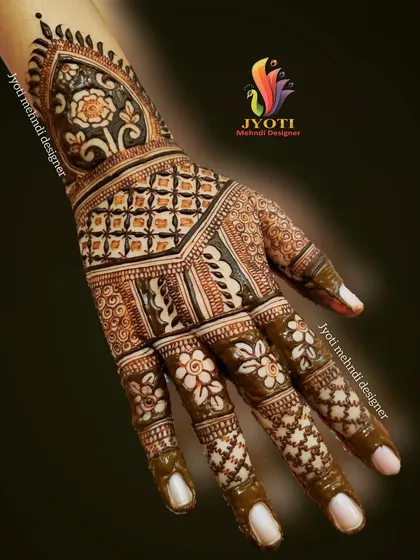 A stunning back-hand design with heavy, intricate work. This Indo-Western style uses negative space and detailed patterns for a dramatic effect.