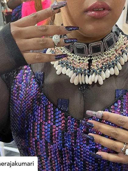 A close-up of the intricate, textured nail art I created for Raja Kumari's look.