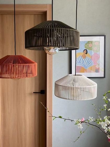 A collection of our drum-shaped pendant lights in three different colors. This image highlights how our designs can be customized with different finishes to suit a variety of decor styles, from neutral to bold.