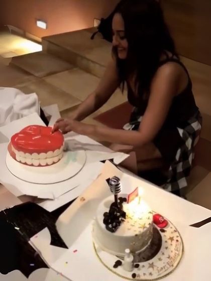 Sonakshi Sinha cutting into one of her birthday cakes. For this celebration, she had two of my custom themed cakes.
