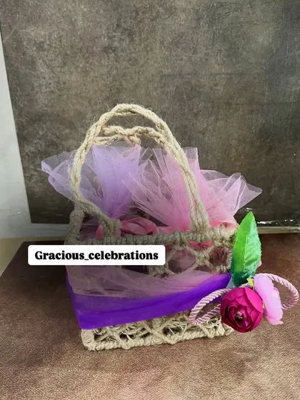The complete small jute bag hamper, packed and ready to be gifted. The floral and ribbon decoration can be matched to your theme.