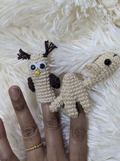 Another view of the owl and camel finger puppets together.