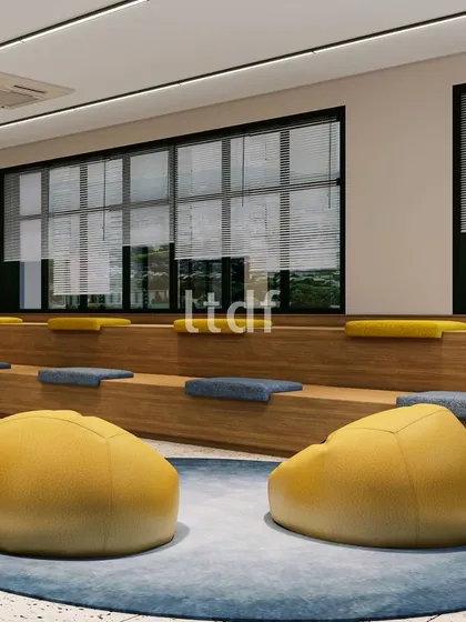 This versatile hall in an institutional project is designed for both recreational activities and quiet relaxation. With flexible design elements like tiered seating and comfortable beanbags, it offers an environment that encourages engagement and caters to the diverse needs of students.