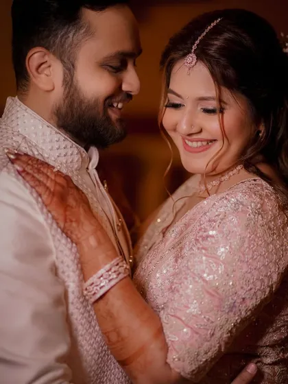 An intimate close-up of the engaged couple, their happy smiles and gentle embrace capturing the warmth and love of the moment.