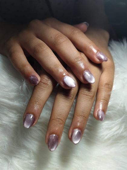 Sleek, shiny, and simply stunning. These metallic lavender cat-eye nails are the perfect mix of elegance and modern style.