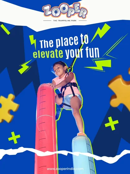 The place to elevate your fun. A young climber tackles the inflatable climbing pillars, a unique and fun challenge for building confidence.